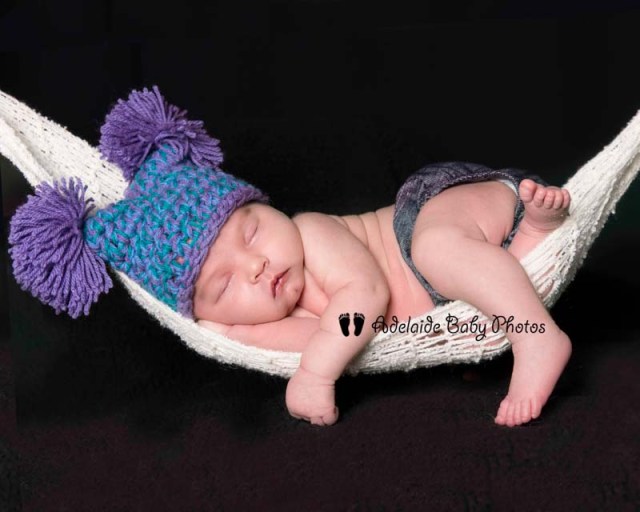 Photograph of newborn baby in hammock by Adelaide Baby Photos